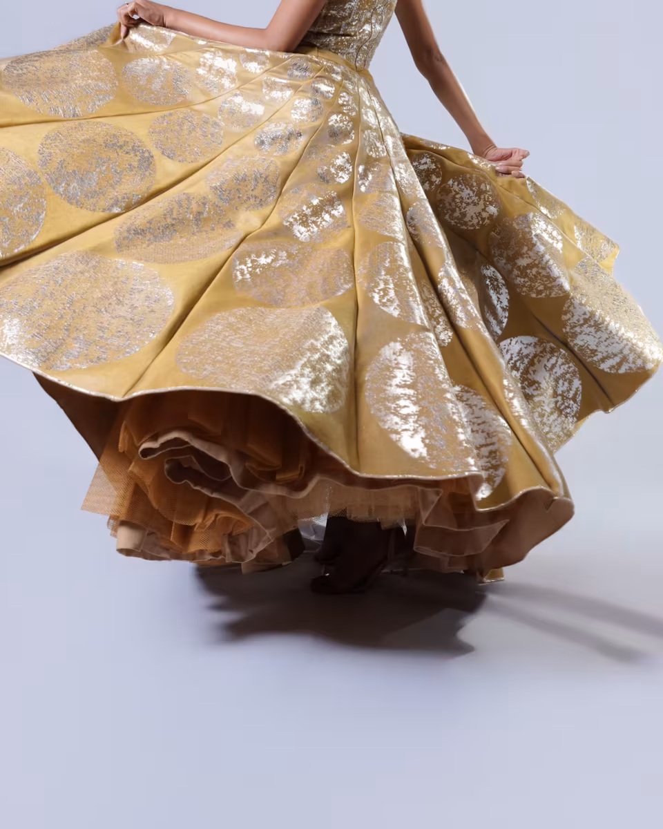 Gold brocade flare skirt detail